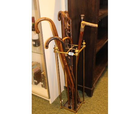 Brass Umbrella stand with assorted Canes inc. Silver topped, Twisted Briar etc 