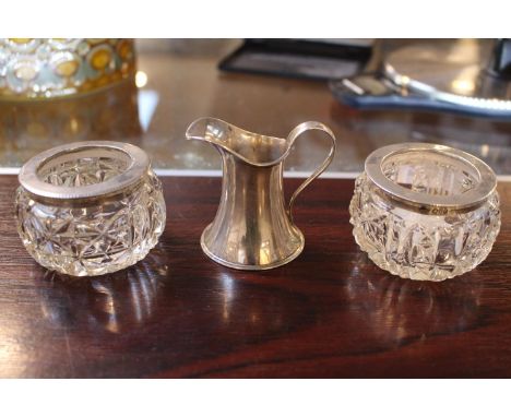 Pair of Silver topped Glass salts and a Miniature Silver Jug 