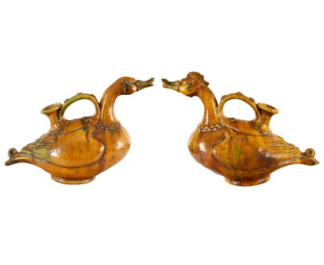 A PAIR OF CHINESE SANCAI-GLAZED CERAMIC 'DUCK' EWERSin Tang dynasty style, formed as a male and female duck, each with flower