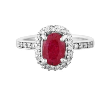 2.52CT RUBY SET IN 14K SILVER RINGoval cut ruby surrounded by a pave of twenty round cut diamonds, flanked by nine round cut 