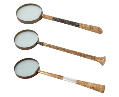 A SET OF THREE VICTORIAN BRASS MAGNIFYING GLASSES, LATE 19TH CENTURYcomprising:a) with mother-of-pearl handle, monogrammed QW