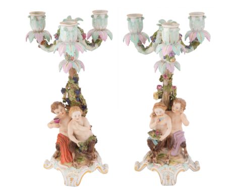 A PAIR OF PORCELAIN CANDELABRA, MEISSEN, LATE 19TH CENTURYa pair of candelabra featuring two different sets of putti, one set