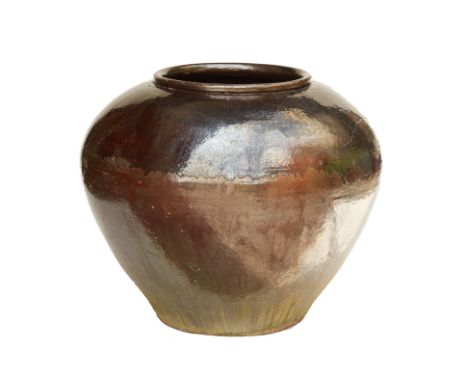 A DRIP GLAZED CERAMIC POT
With a black and brown glaze and lipped rim
84cm high x 110cm diameter
Condition: Viewing is advise