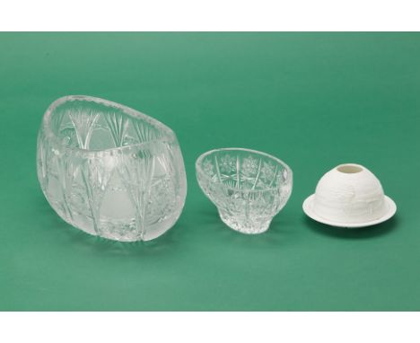 TWO CRYSTAL BOWLS &amp; A LIMOGES PORCELAIN TEALIGHT HOLDER
The cut glass bowls of oval form, with star motifs, the porcelain