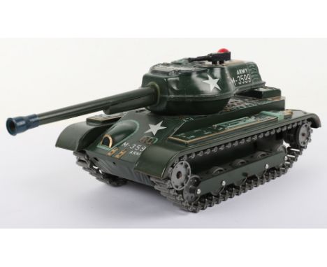 A Masudaya tinplate battery operated Army M-3599 Tank, finished in green with lithographed details, mounted machine gun and l