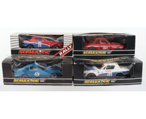 Four Vintage Scalextric Boxed Slot Cars, C.053 Datsun 260Z with decal sheet, C.128 BMW Turbo 320, C.130 Triumph TR7,white/blu