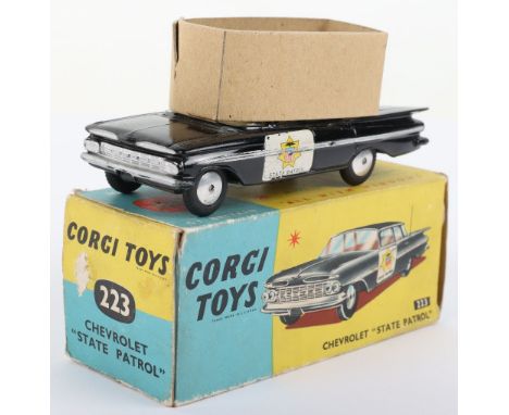 Corgi Toys 223 Chevrolet “State Patrol” Police Car black body, yellow interior, flat spun wheel hubs, in near mint original c