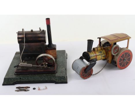 Tinplate clockwork Road Roller, German 1920s, lithographed in yellow and red with pipe and cab details, c/w to rear wheels wi