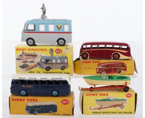 Four Boxed Dinky Toys, 281 (29G) Luxury coach, maroon body, cream flashes, red wheel hubs, 283 B.O.A.C. Coach, dark blue/whit