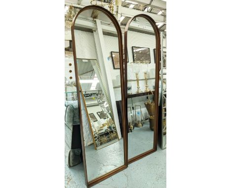 ARCHITECTURAL WALL MIRRORS, a pair, 171cm x 51cm, bronzed frames, contemporary arch top design. (2) 