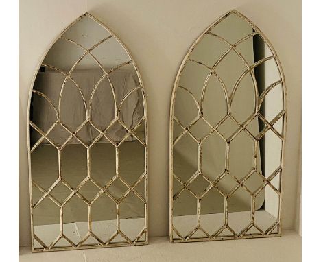 ARCHITECTURAL WALL MIRRORS, a pair, Moorish style arched design, aged white painted, 132cm x 66cm. (2) 