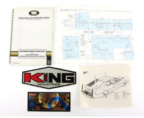 James Bond movie props including King Industries metal plaque, Decommissioning Guidelines Manual &amp; a Tracking System disp