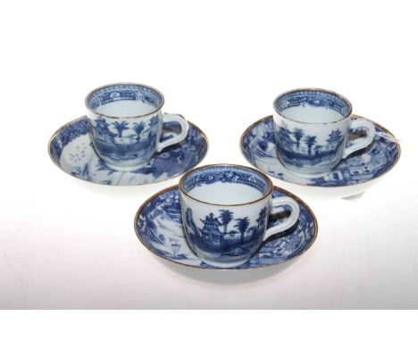 Three Chinese blue and white cups and saucers