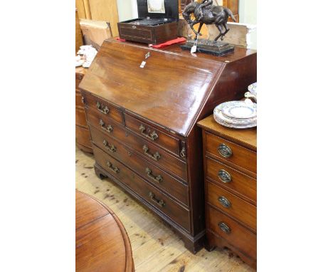 Georgian mahogany five drawer bureau on shaped bracket feet, 110cm by 116cm