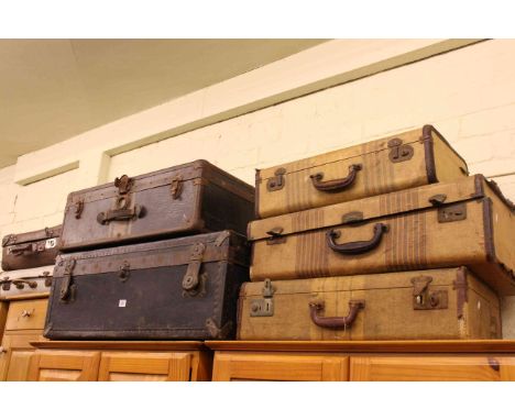 Two vintage trunks and five suitcases