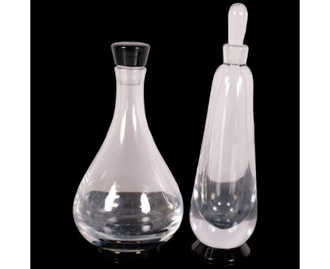 Orrefors, Sweden, two decanters with black foot, both marked to base Orrefors, slim decanter HN 137/1Y?, tallest 32.5cmstoppe