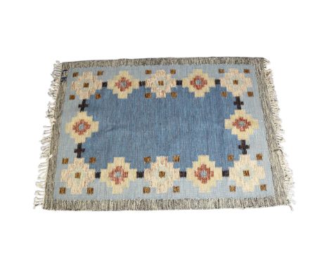 A vintage Swedish double sided flat weave rug (Rollakan), central mottled blue panel with repeated geometric flower border, s