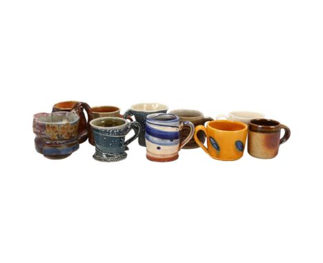 A collection of 10 studio pottery mugs, including Walter Keeler, Nic Collins, Hilary Roberts, Richard Phethean, Marianne De T