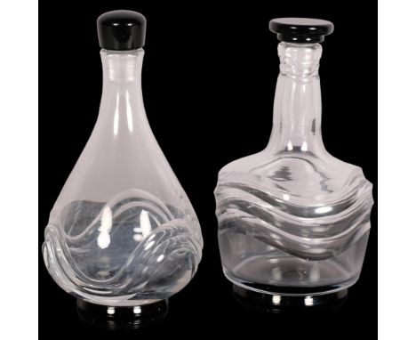 Simon Gate for Orrefors, two wave pattern decanters with black glass foot and stopper, 1920s/30s design, marked to base OF GA