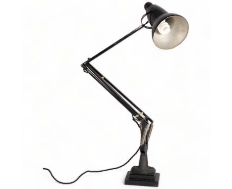 A Herbert Terry, black Anglepoise lamp, originally bench mounted, now mounted on two-step iron block, makers stamp, height 92