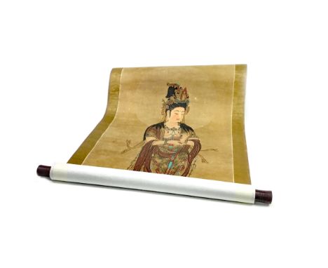 CHINESE SCROLL PAINTING, depicting Guanyin modelled standing on a lotus, the image size 98cm x 41cm