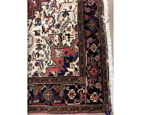 LARGE EASTERN CARPET, in shades of blue, red and brown