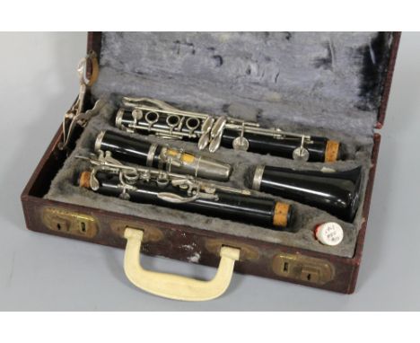 A CASED 'BOOSEY & HAWKES' REGENT CLARINET' with silver plated sheet music clip Buyers - for shipping pricing on this lot, vis