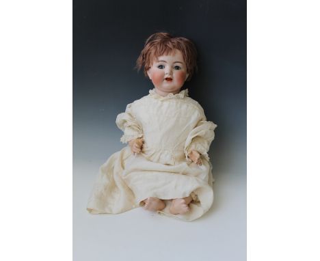 A SIMON AND HALBIG BISQUE HEADED DOLL, with blue weighted sleeping eyes, open mouth with two teeth, composition body and arti