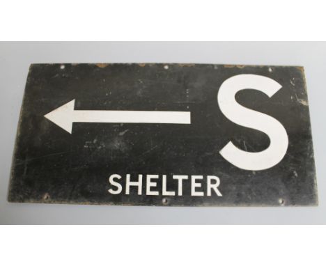 A WWII DOUBLE SIDED AIR RAID SHELTER DIRECTIONAL ENAMEL SIGN, inscribed 'S Shelter' with arrow, in black and white, 60.5 x 30