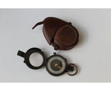 A MILITARY VERNIERS PATTERN POCKET COMPASS, in the original leather stitched case Buyers - for shipping pricing on this lot, 