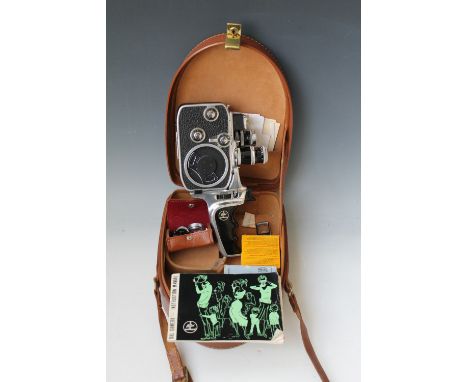 A BOLEX PAILLARD D8L HAND HELD CINE CAMERA, in original leather case with lenses, instruction manual etc. Buyers - for shippi