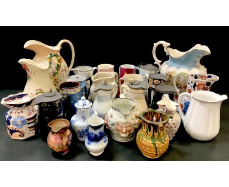 A collection of late 19th century and later jugs, comprising a Crown Devon Fieldings blush ivory wash jug; a Clarice Cliff Ce