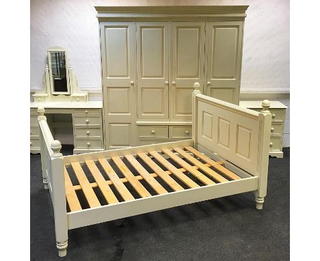 A modern painted pine bedroom suite comprising compactor wardrobe, dressing table, dressing mirror, chest of drawers and doub