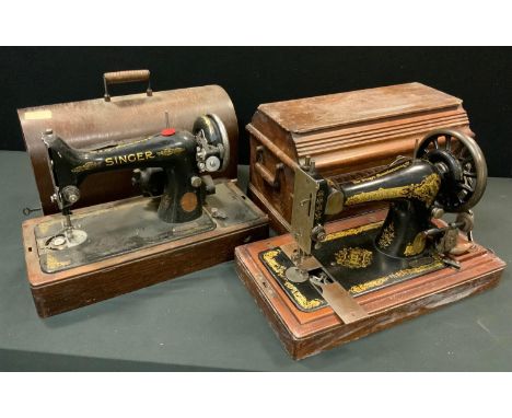A vintage portable Singer hand operated sewing machine;  another electronic with built-in light (2) 