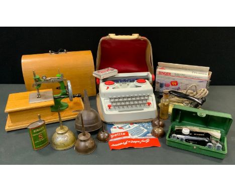 A small Grain hand operated portable sewing machine, light oak case;  a Petite typewriter, Singer Handy stitch, Singer and ot