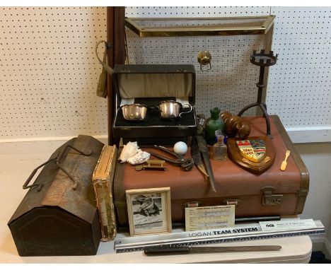 An Arts and Craft cast iron candlestick, castellated drip pan, tripod legs;  a tripod;  advertising rules;  tools;  blue eye 