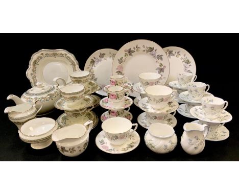 A Royal Worcester June Garland part tea set; a Royal Worcester Royal Garden pattern part coffee set; a Queens Woman and Home 