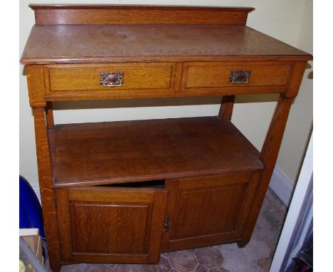 A late 19th century oak buffet, two drawers above open shelf and two cupboard doors, 110cm high, 110cm wide, c.1890