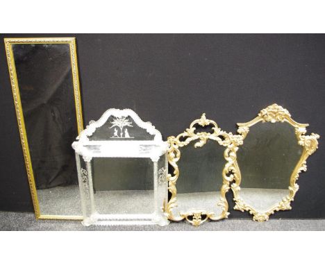 A Venetian style arched top mirror, engraved with figures and floral motifs, 74cm x 52xm; others shaped gilt metal frames etc