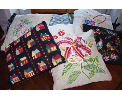 A tapestry cushion, embroidered with an orchid, on a cream ground; others, various (8)