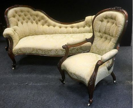 A rosewood two piece salon suite comprising button back sofa, scrolling Arms, serpentine seat, French cabriole forelegs, cera