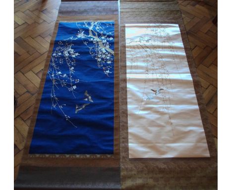 A Chinese embroidered silk scroll, with bird on a blossom tree, 195cm x 54cm; another (2)