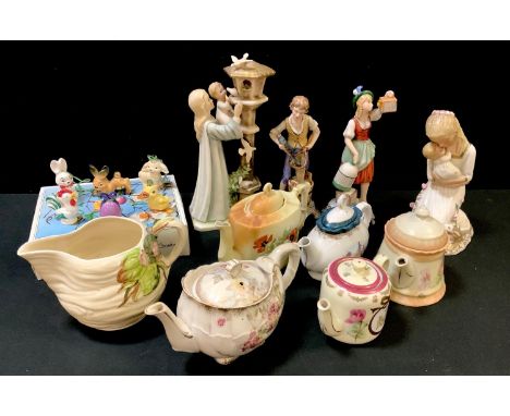 A Clarice Cliff Newport jug; a pair of Goebel figures modelled as a girl and boy; a boxed set of six Goebel hanging decoratio
