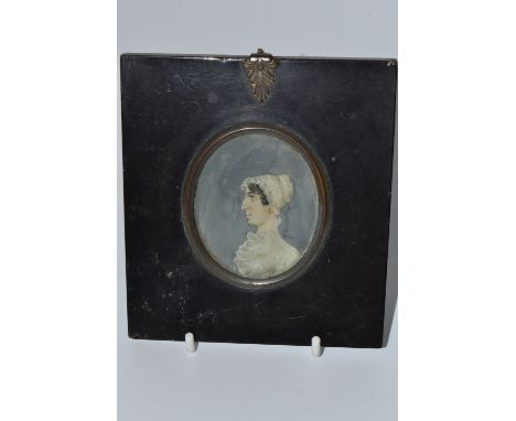 English School (early 19th century), a portrait miniature, of a young lady, bust length, facing to dexter, wearing a lace bon