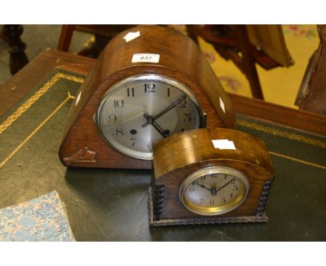 A 1940s oak shaped triangular mantel clock, the silvered 14cm dial with Arabic numerals, striking on a gong, the case applied