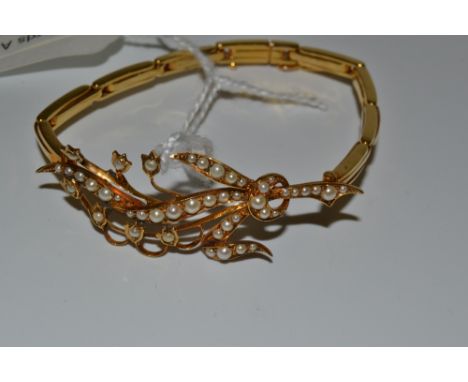 A seed pearl and gold coloured bracelet, (conversion)