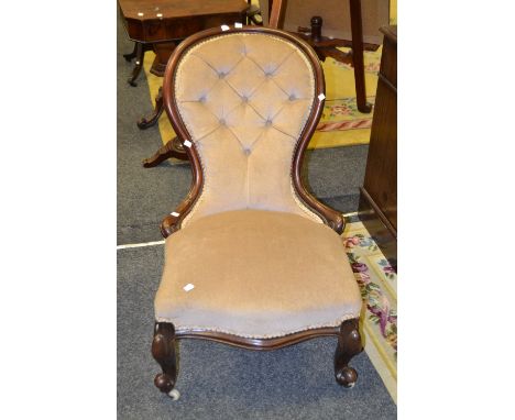 A Victorian stained mahogany button back nursing chair