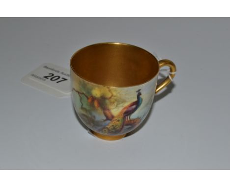 A Royal Worcester cabinet cup, painted by A Watkins, signed, with a peacock, gilt interior and handle, printed puce crown and