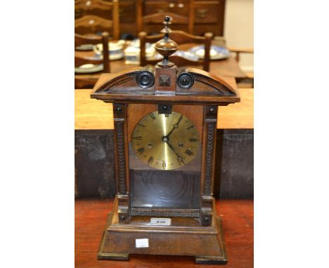 A 20th century Smiths mantel clock, 12.5cm brass dial with Roman numerals, moulded finial, pediment and pilasters, 46cm high,
