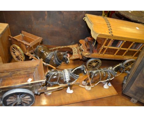 A 20th century light display, as a ceramic horse connecting to a gypsy wagon; a similar display (2)